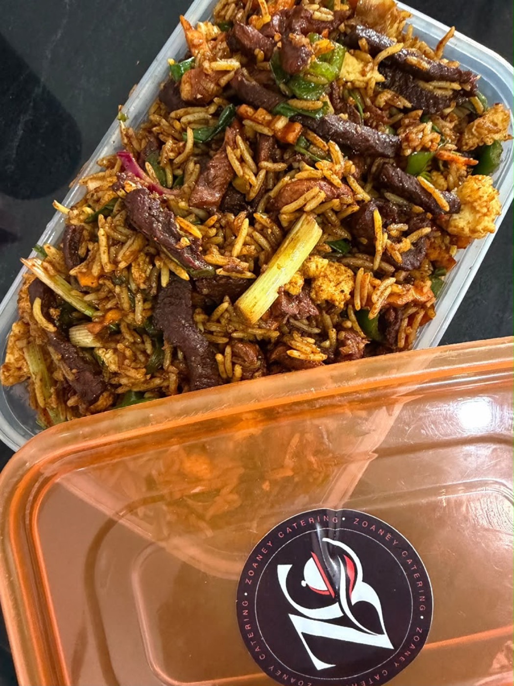 Signature Chinese fried rice with beef strips, spring onion and peppers